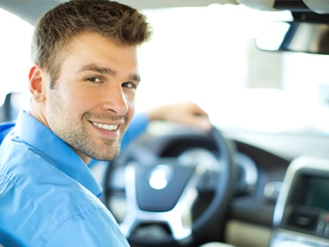 Driver looking over his shoulder at a passenger