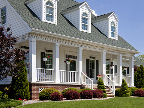 Colonial-style home with porch