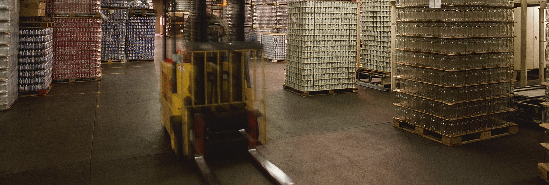 Forklift moving through a warehouse